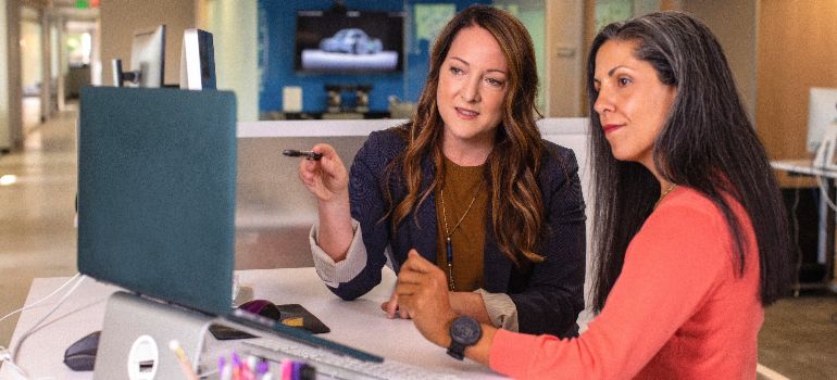 two women trying to create an open concept floor plan