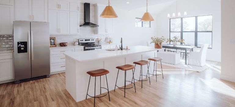 white kitchen with a dining table