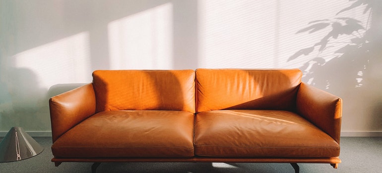Orange sofa after babyproofing your Marysville home