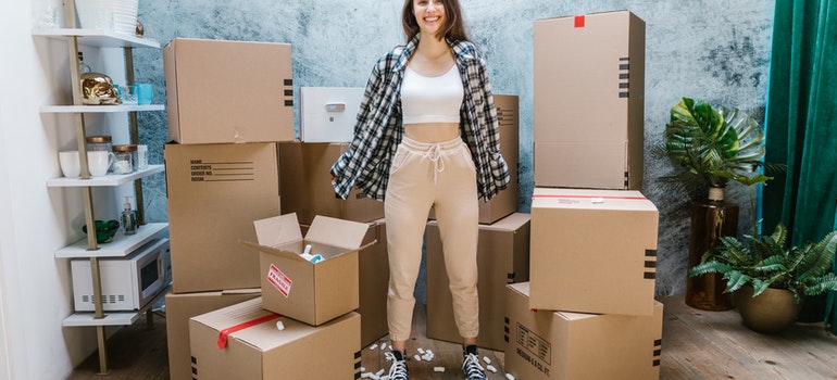Girl surrounded by boxes