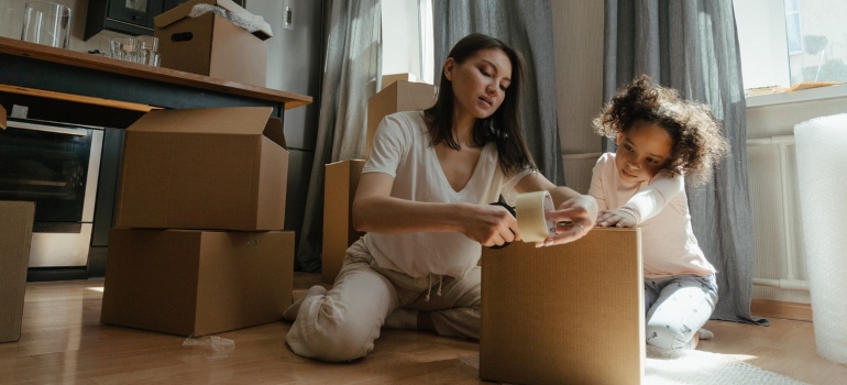 A mother and daughter using healthy packing habits for Seattle homeowners
