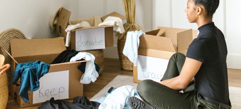 woman sorting through boxed items