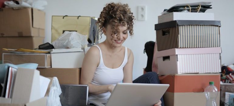 woman sitting in clutter