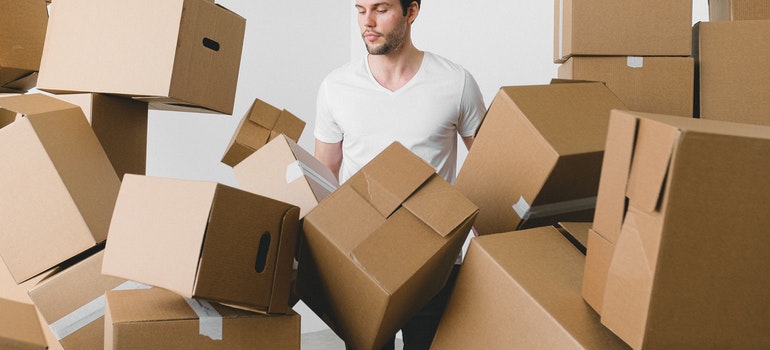 Man surrounded by boxes