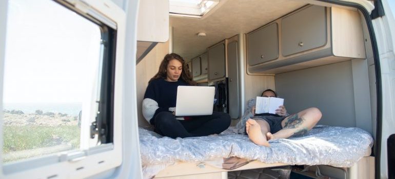 a couple in their RV prepared for full-time RV living