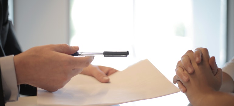 Businessman gives a contract to a woman