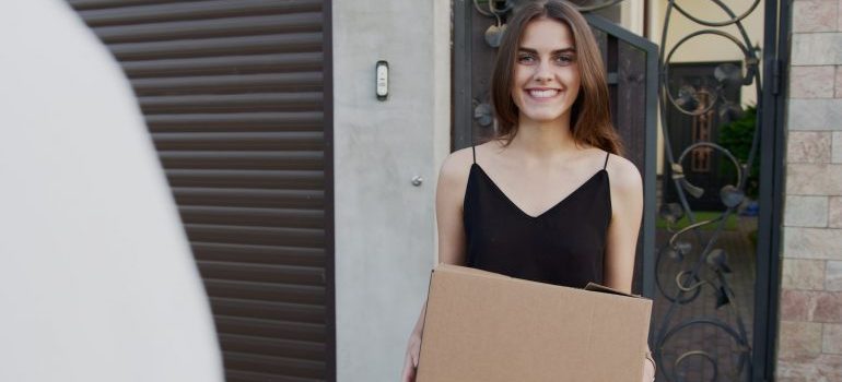 smiling woman helping you with storing your outdoor equipment