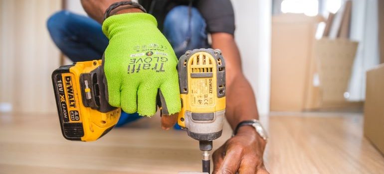 a man renovating a floor using dewalt cordless