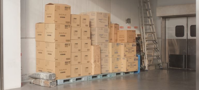 A look into a storage unit with boxes stacked inside it