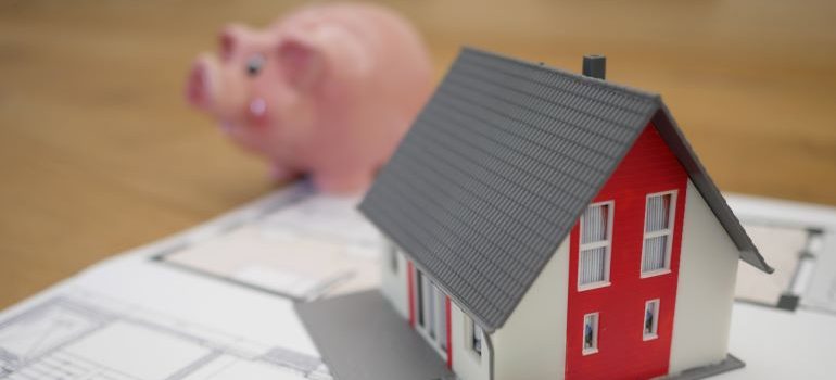 pink piggy bank and a model house