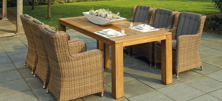 a set of garden chairs and a table made of weaves 