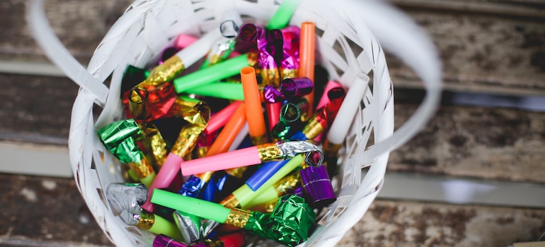 A basket full of party decorations.