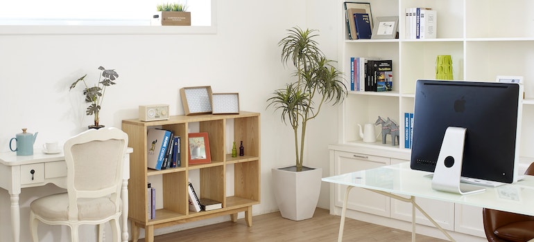 A cube shelf is in a room.