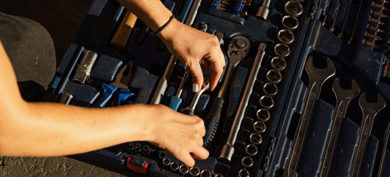 Person packing tools before they store hand and power tools in self storage