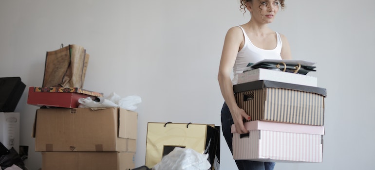 A woman packing items to store them in mobile portable storage unit