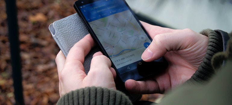 person looking at maps on a phone
