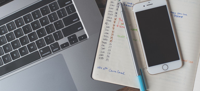 phone and a pencil on a planner