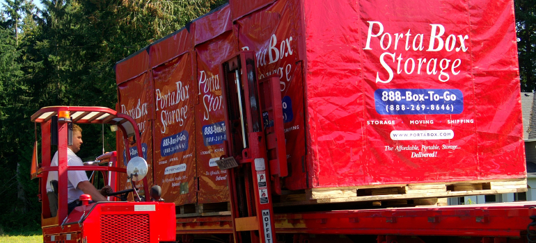 a worker loading a portabox container