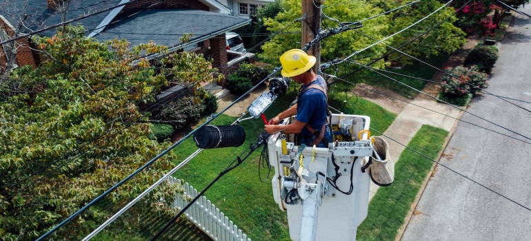 an electrician working on wires as a part of Exploring the cost of living in Lynnwood, WA guide