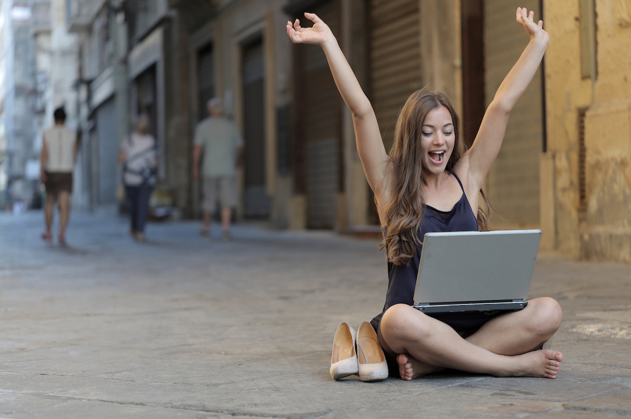 A woman sitting in the street