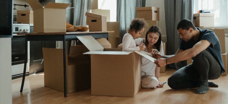 A Seattle family with a child packing for a move