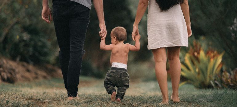 A growing family walking happily because Seattle mobile storage fulfills the needs of growing families