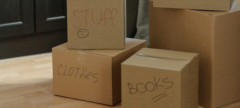 Boxes with different house items packed inside