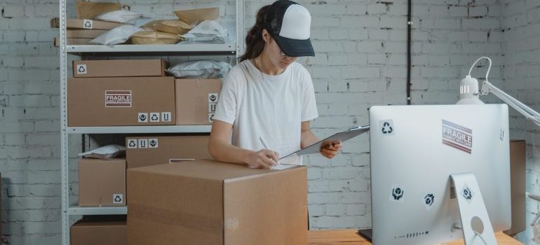 A girl checking the boxes in mobile storage for Seattle's sports teams