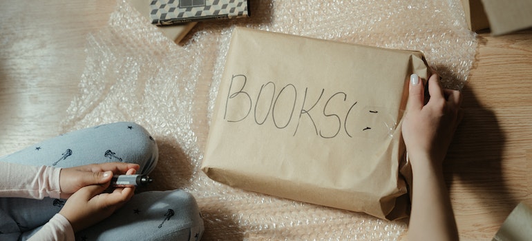 person packing books