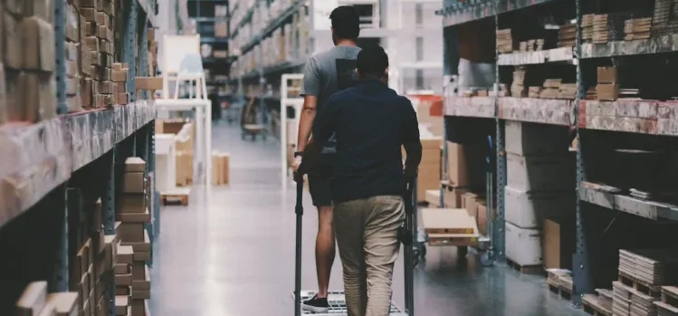 Men walking around storage