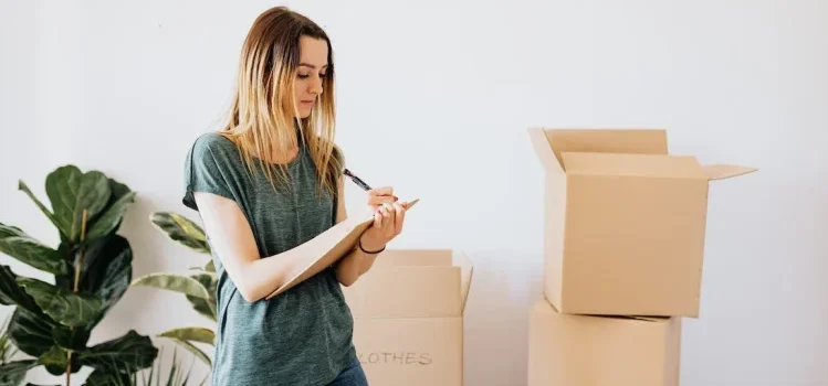 A woman writing something on the pad while storing your Lynnwood home