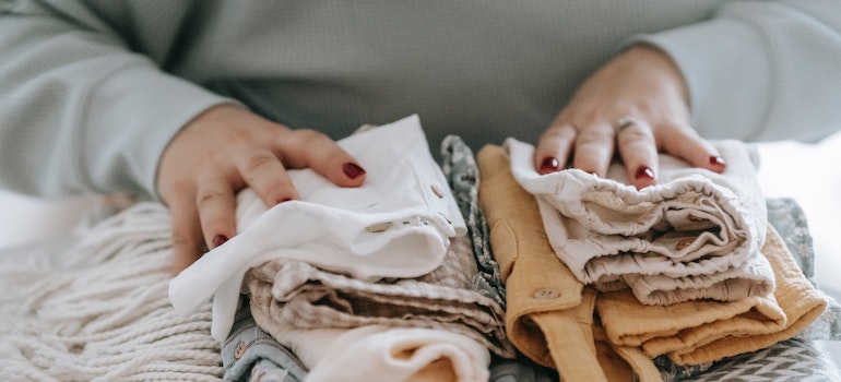 A person folding clothes