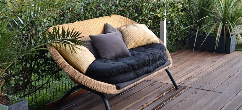 Garden sofa surrounded by plants