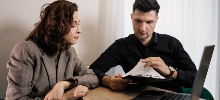 A couple reading a document for Starting a Home-Based Business in Seattle