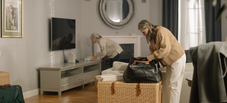 Two women packing their bags