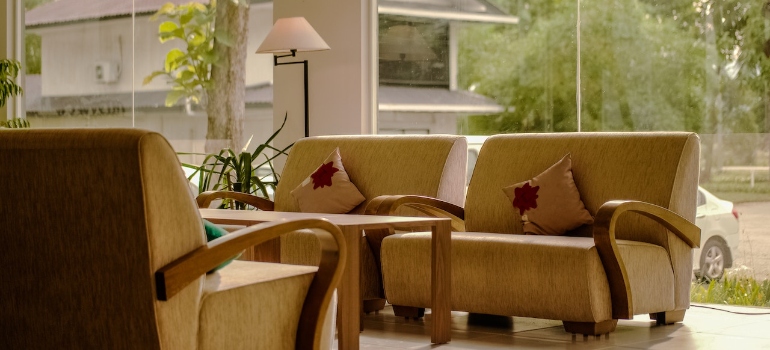 A living room with yellow sofas