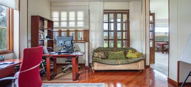 Room with a couch, a home office and other space-saving furniture for your Shoreline home