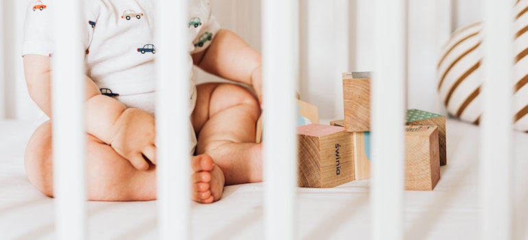 Baby Sitting and Playing in the Cradle