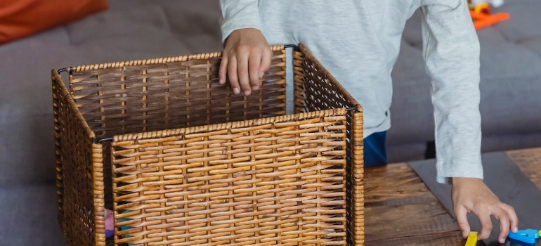 A person with a box ready to preserve kids' school keepsakes