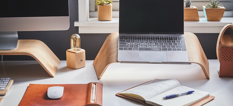 a home office station with a pc and a laptop