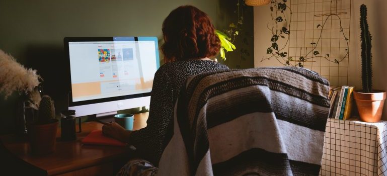 Woman working on her computer in a home office