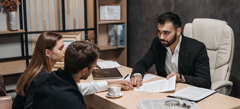 A lawyer talking with a couple in an office