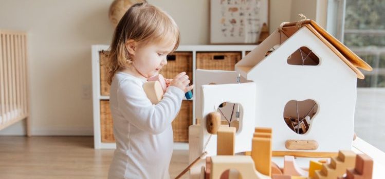 A little girl playing at home
