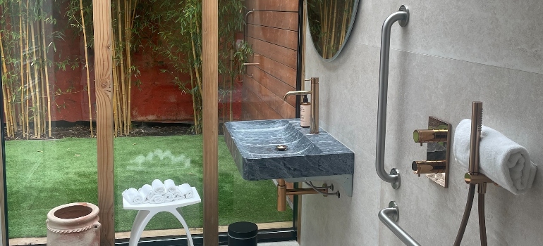 a bathroom with hand rails