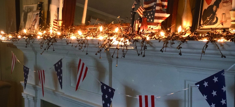 4th of July decorations on a white fireplace mantle