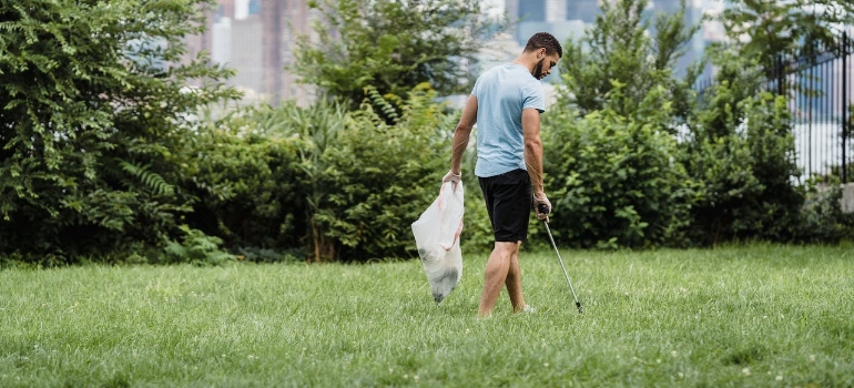 a man cleaning a park to support eco-friendly living in Lynnwood