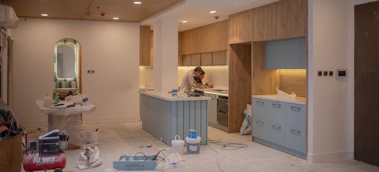 Men working inside a house under home remediation projects
