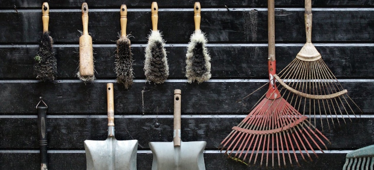 Gardening tools hanging on a wall