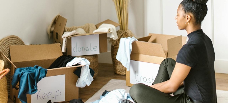 A woman adopting a minimalist lifestyle in Marysville by decluttering