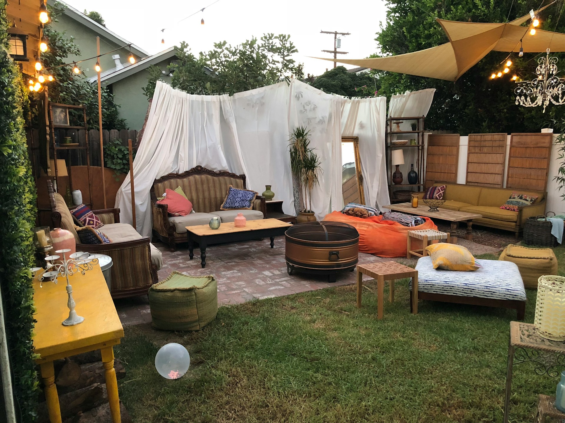 Furniture arranged in a backyard for a successful pre-move garage sale